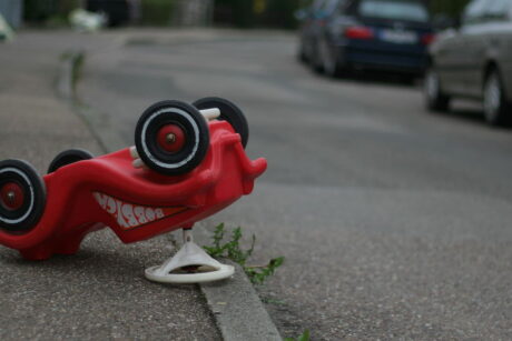 An upturned child's Bobby Car. Quality tuition will teach you how to become a safe driver.